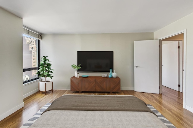 bedroom with light wood-type flooring