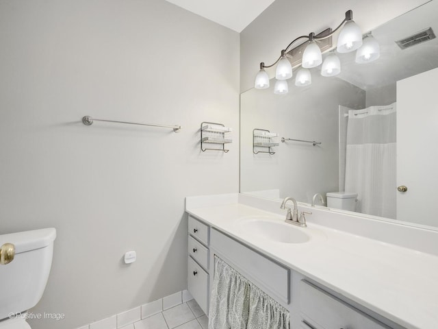 bathroom with tile patterned flooring, vanity, curtained shower, and toilet