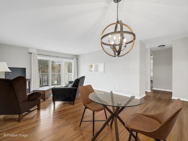 dining room with an inviting chandelier and hardwood / wood-style floors