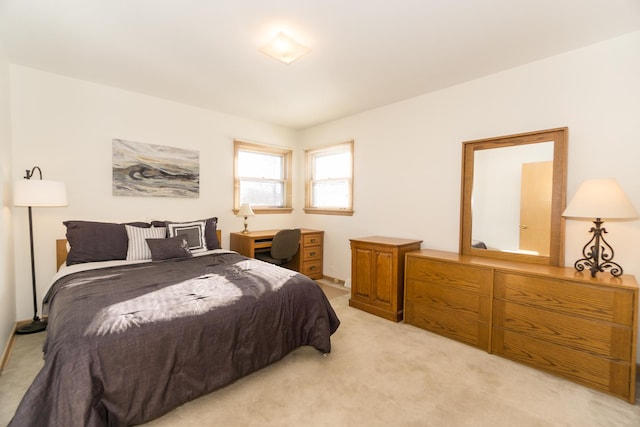 bedroom with light colored carpet