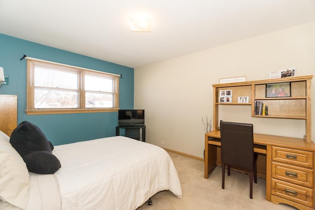 bedroom with light colored carpet