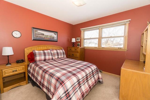 bedroom featuring light colored carpet