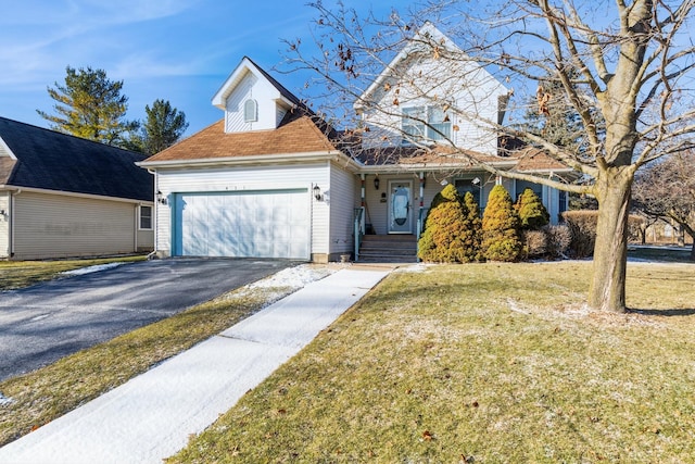 view of front of house featuring a front yard and a garage