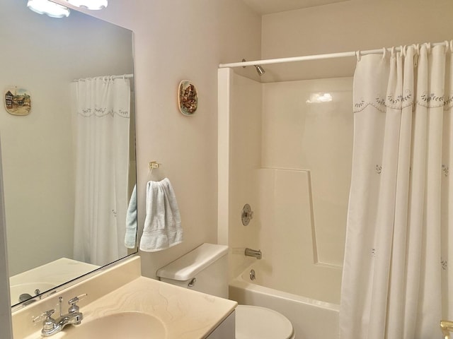 full bathroom featuring toilet, vanity, and shower / bath combination with curtain