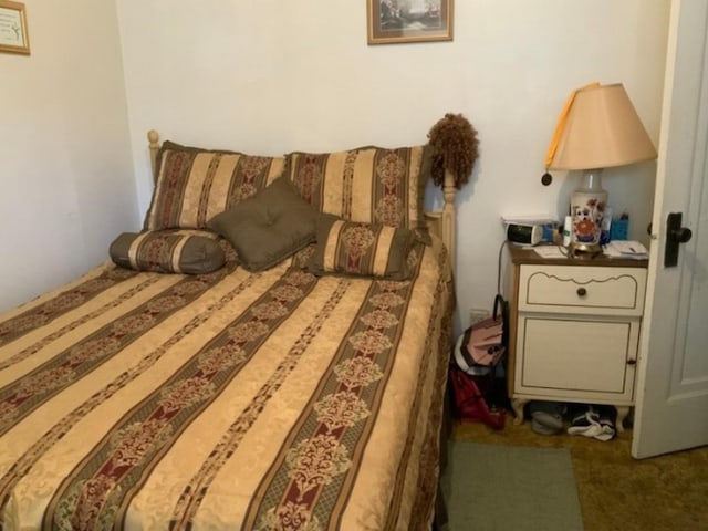 bedroom featuring dark carpet