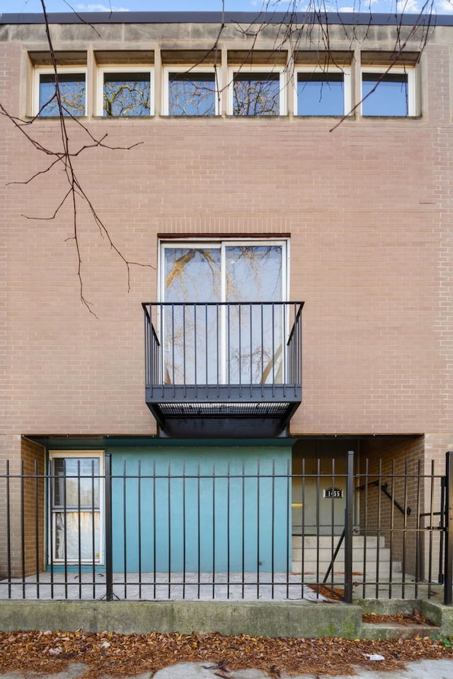 back of house with a balcony