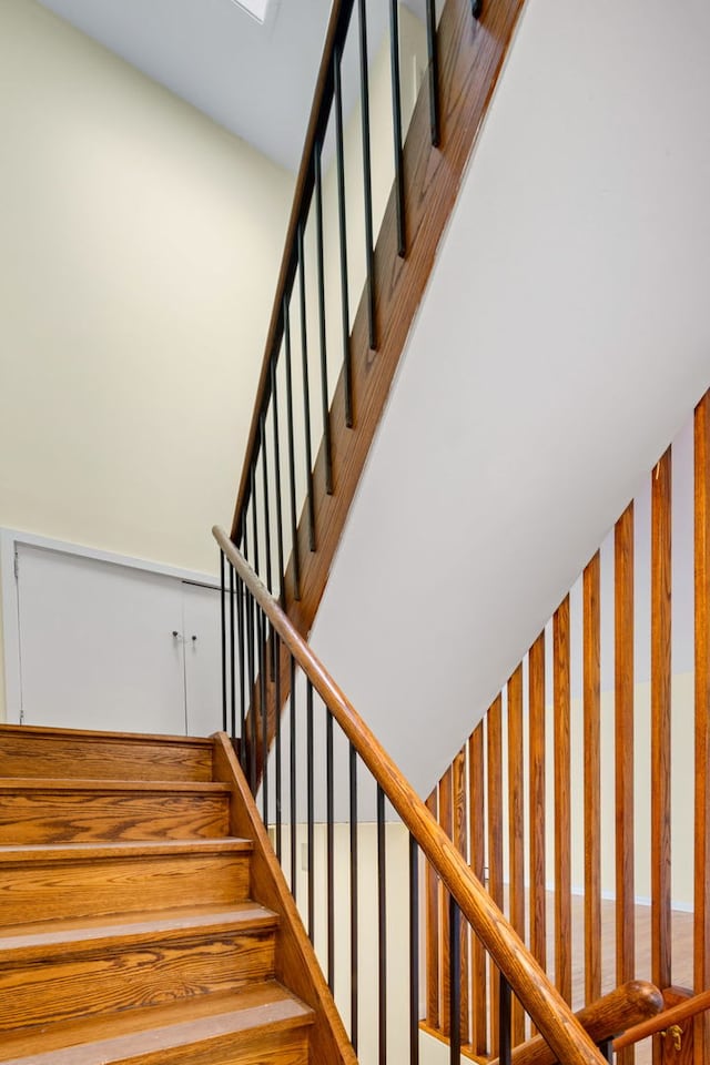 stairs featuring a high ceiling