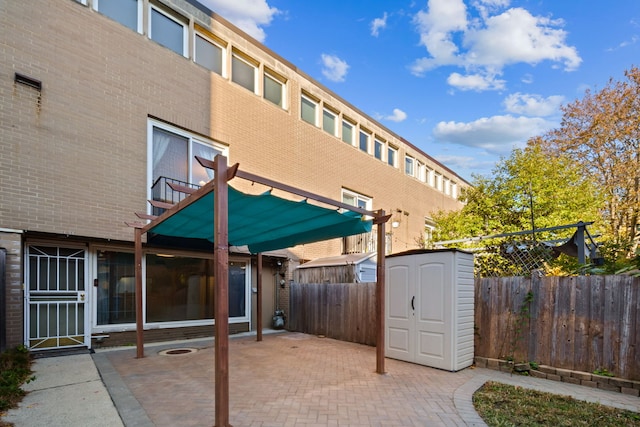 view of patio with a storage unit