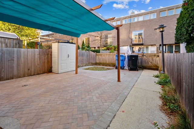 view of patio featuring a shed