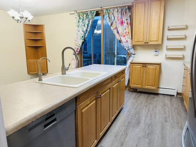 kitchen featuring dishwasher, hanging light fixtures, sink, light hardwood / wood-style flooring, and an inviting chandelier