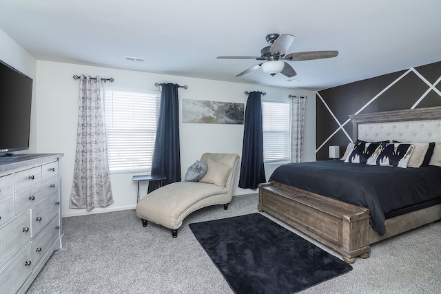 bedroom with ceiling fan and light colored carpet