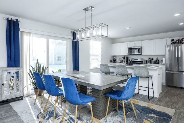 dining area featuring dark hardwood / wood-style floors