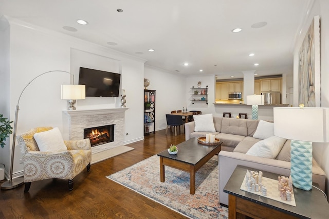 living room featuring ornamental molding and dark hardwood / wood-style floors