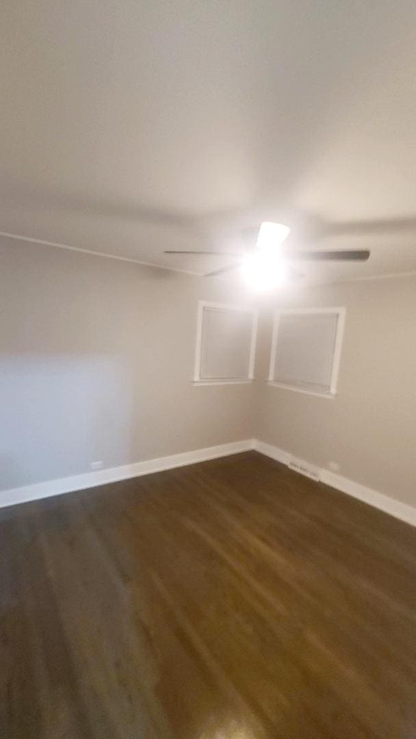 empty room featuring dark hardwood / wood-style flooring