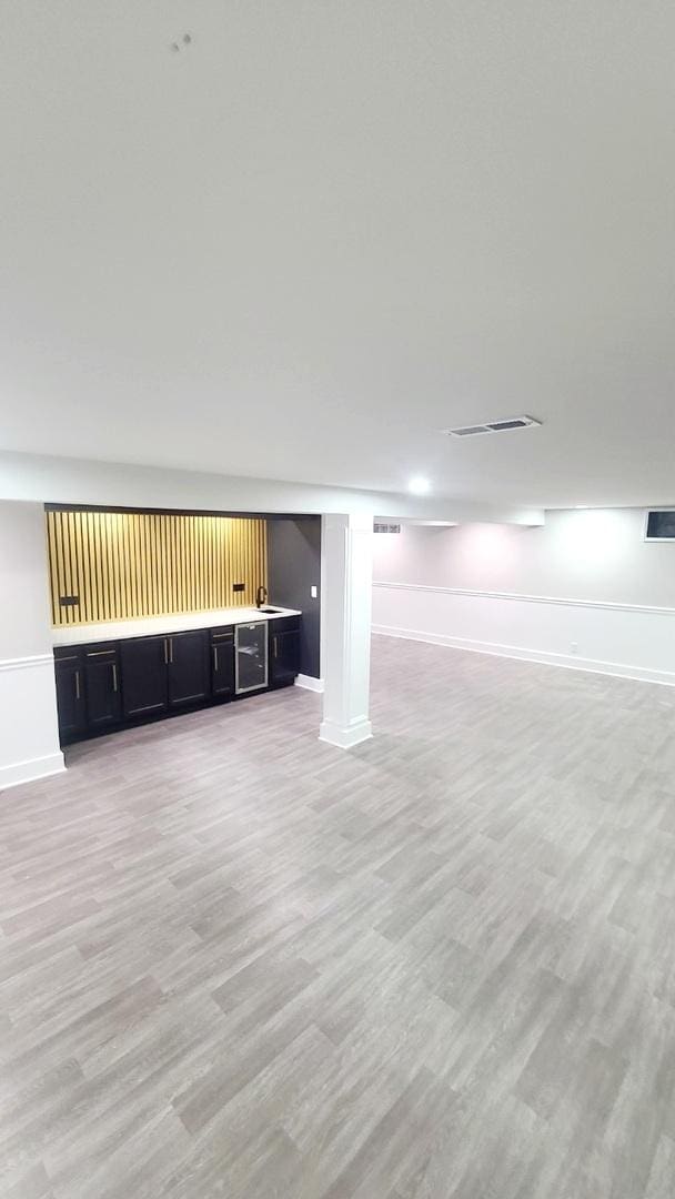 basement featuring light hardwood / wood-style flooring