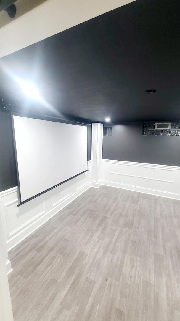 home theater room with light hardwood / wood-style floors