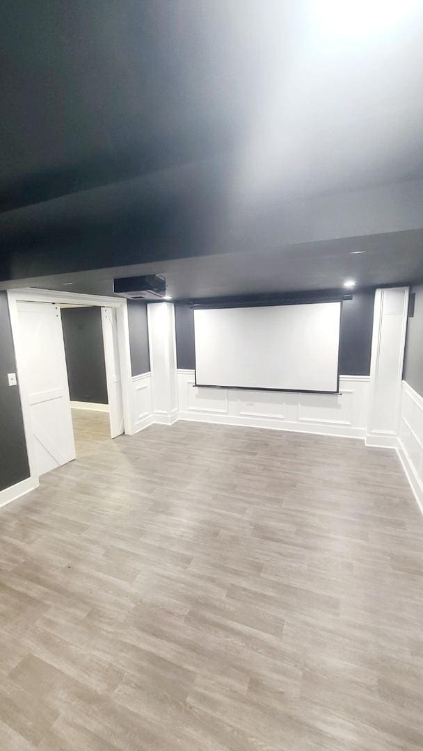 home theater room with light wood-type flooring