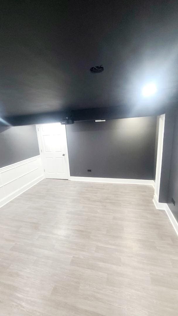 empty room with light hardwood / wood-style floors