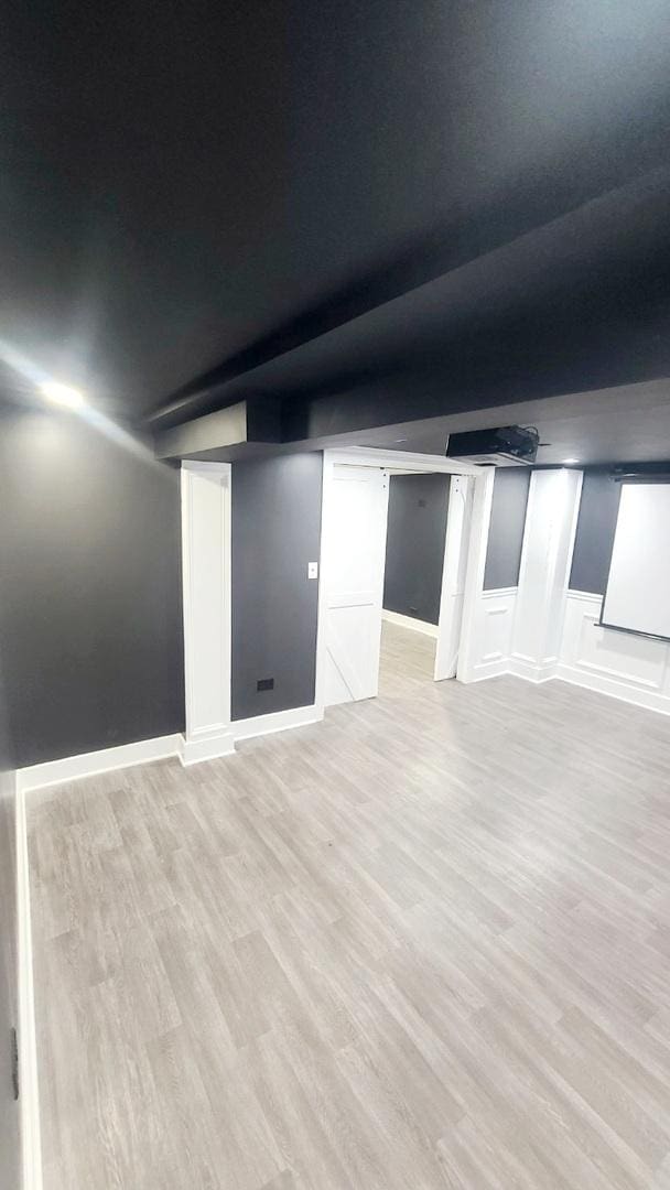 basement with light wood-type flooring