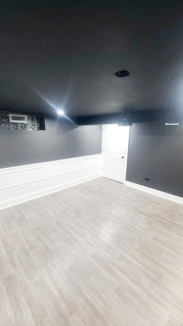 basement featuring light hardwood / wood-style flooring