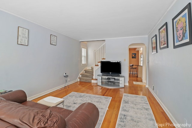 living room featuring ornamental molding and hardwood / wood-style floors