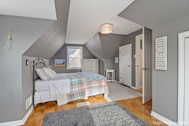 bedroom with vaulted ceiling