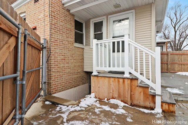 view of snow covered property entrance