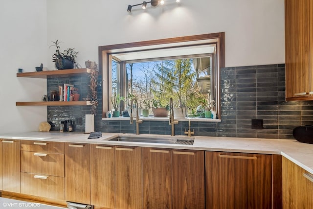 bar featuring sink and backsplash