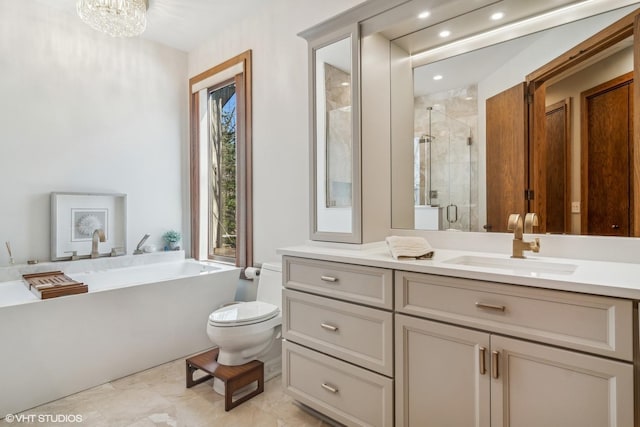 full bathroom with vanity, shower with separate bathtub, an inviting chandelier, and toilet