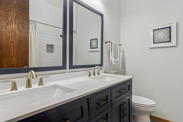 bathroom featuring vanity, a shower with curtain, and toilet