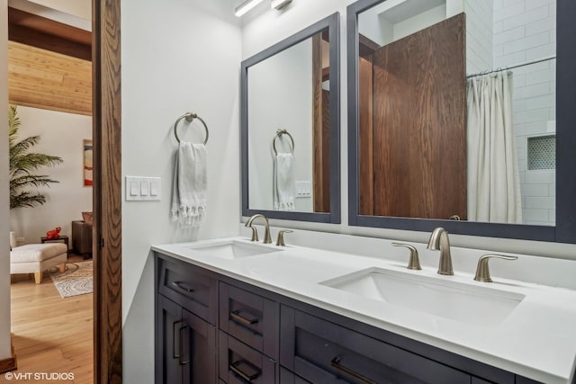 bathroom featuring vanity and hardwood / wood-style floors