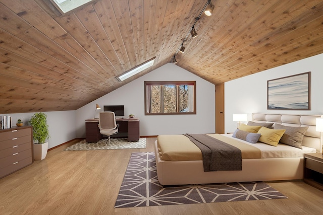 bedroom featuring wood ceiling, light hardwood / wood-style flooring, and lofted ceiling with skylight