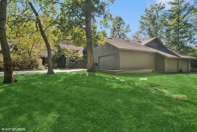 view of side of home with a yard