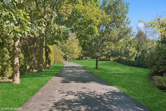 surrounding community featuring a lawn