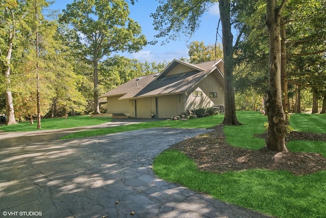 view of home's exterior featuring a lawn