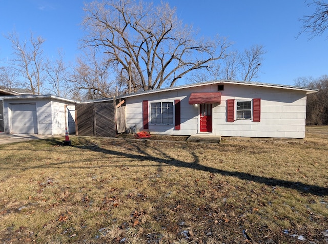 single story home with a front lawn and a garage