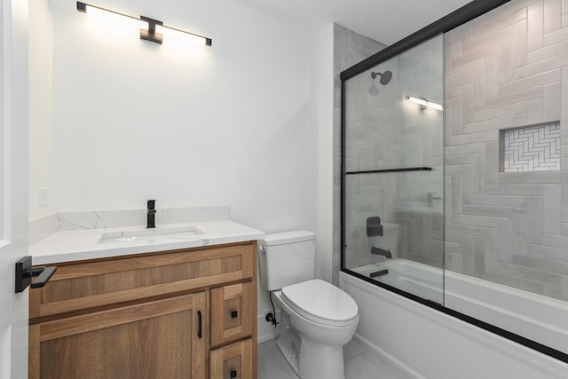 bathroom with combined bath / shower with glass door, vanity, and toilet