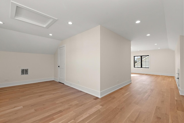 bonus room with recessed lighting, visible vents, baseboards, vaulted ceiling, and light wood-style floors