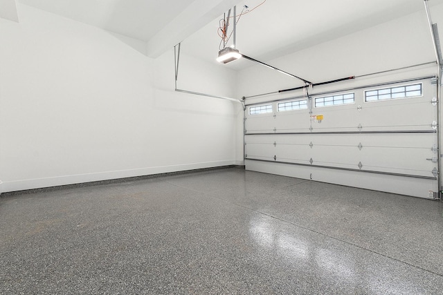 garage featuring baseboards and a garage door opener