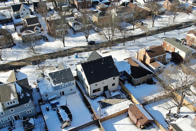 snowy aerial view with a residential view