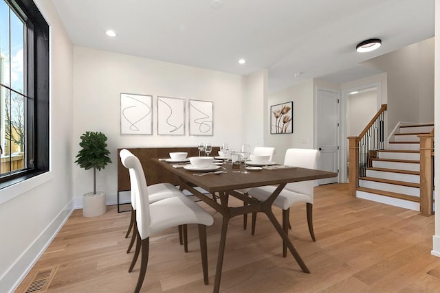 dining space featuring recessed lighting, visible vents, baseboards, stairs, and light wood finished floors