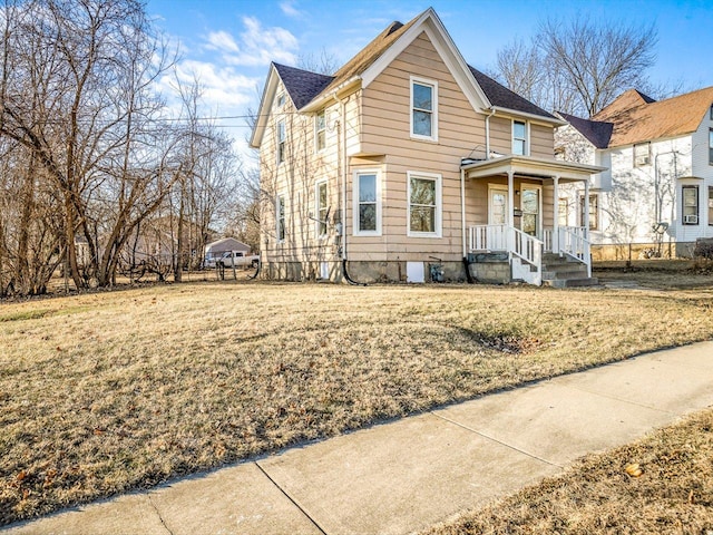 front facade with a front yard