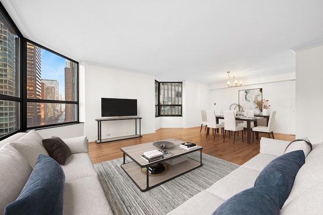 living room with a chandelier and hardwood / wood-style flooring