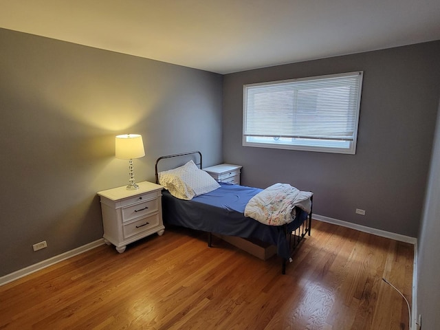 bedroom featuring hardwood / wood-style floors