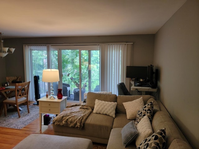 living room with light wood-type flooring and a healthy amount of sunlight