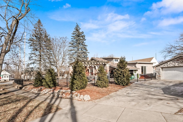 view of front of house featuring a pergola, a garage, and an outdoor structure