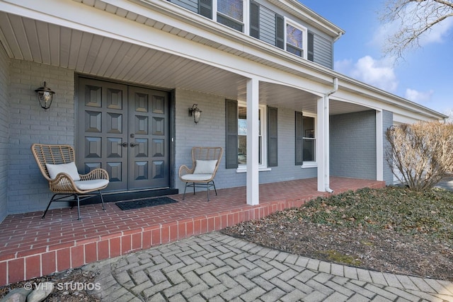 doorway to property featuring covered porch