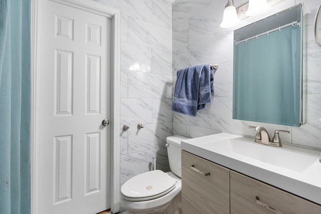 bathroom featuring vanity, toilet, and a shower with shower curtain