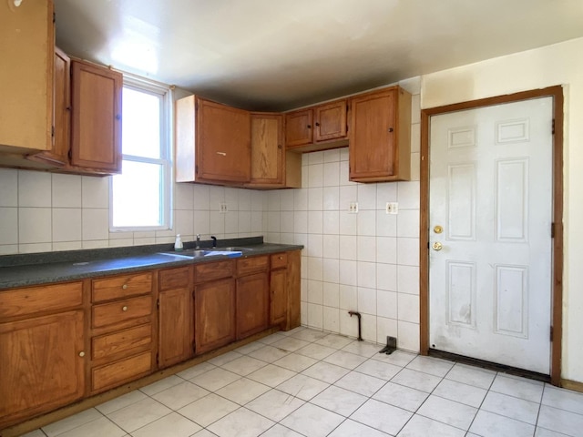 kitchen with tasteful backsplash and sink