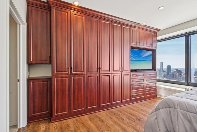 bedroom featuring light wood-style floors and recessed lighting